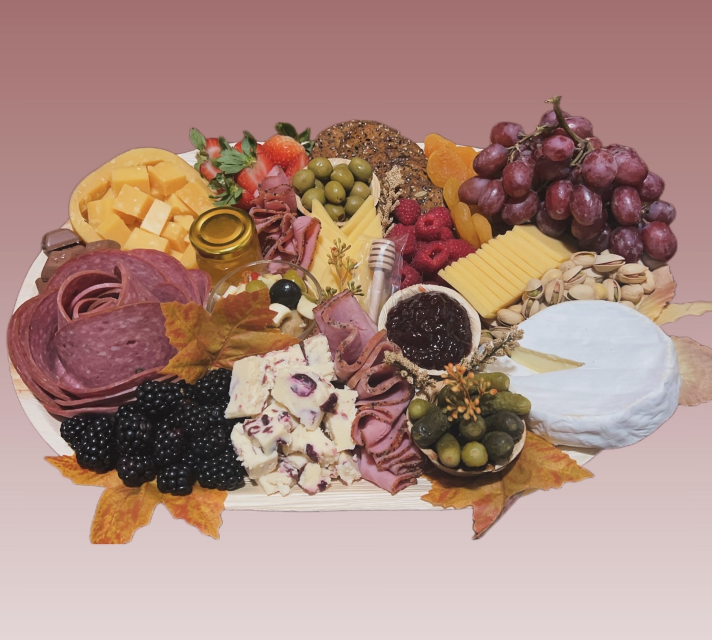 Autumn charcuterie board with fall leaves