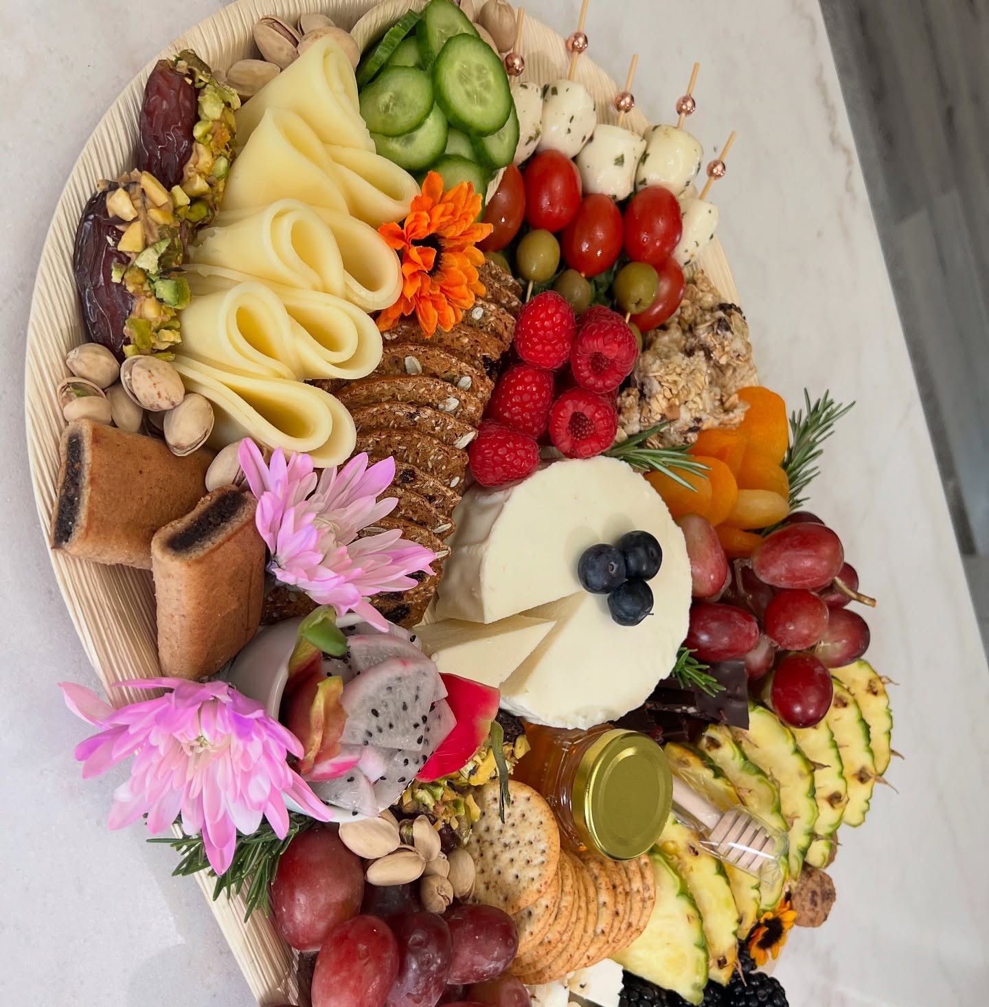 Spring charcuterie board with edible flowers