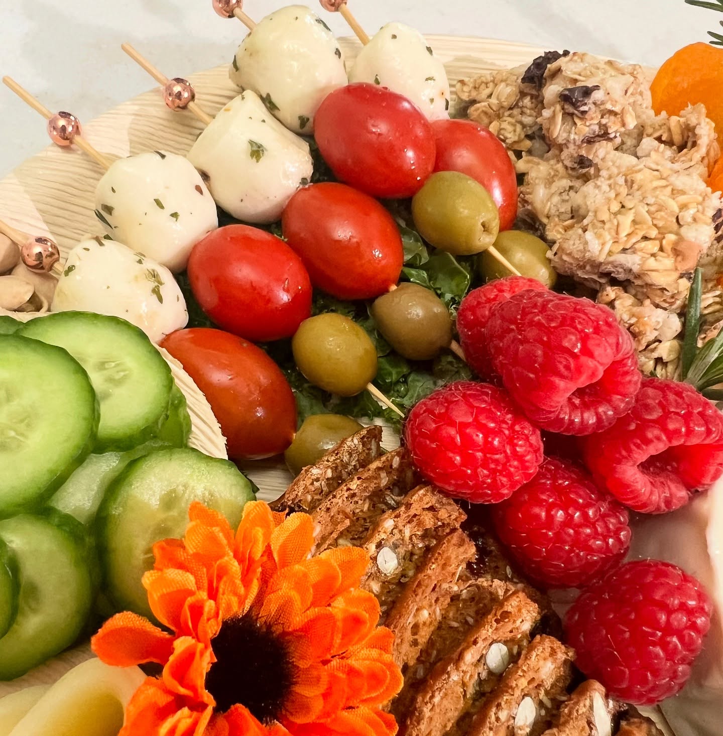 Close-up charcuterie board with fresh vegetables and berries